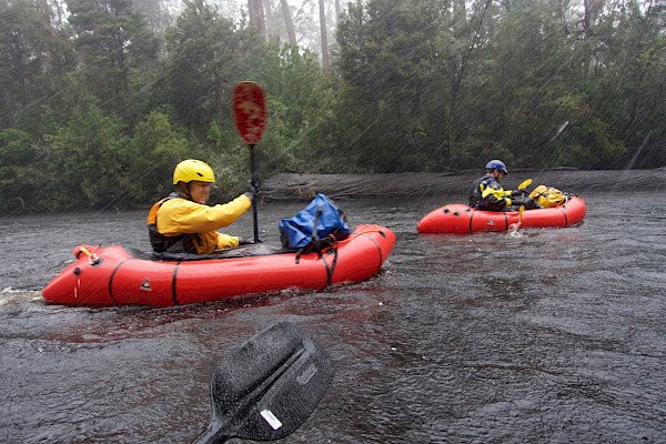 Two rafters pack rafting in the hail