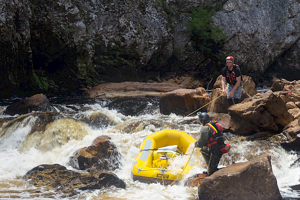 Lining the rafts down a section of river