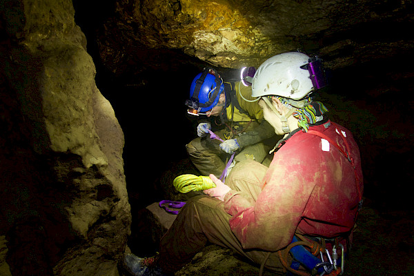 Cavers using some rope