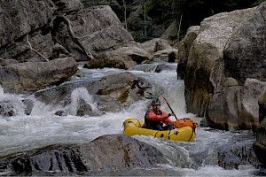 A paddler on a whitewater river