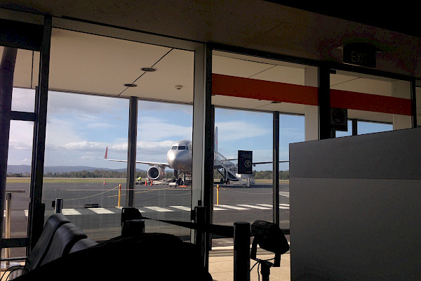 Aeroplane on the tarmac, viewed from the airport departure lounge
