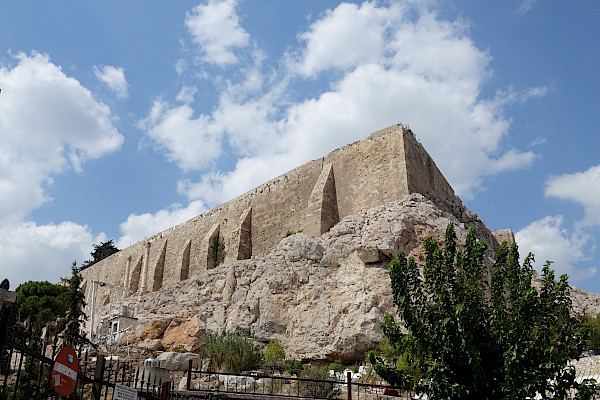 Stone fortress with blue sky and white clouds in the background
